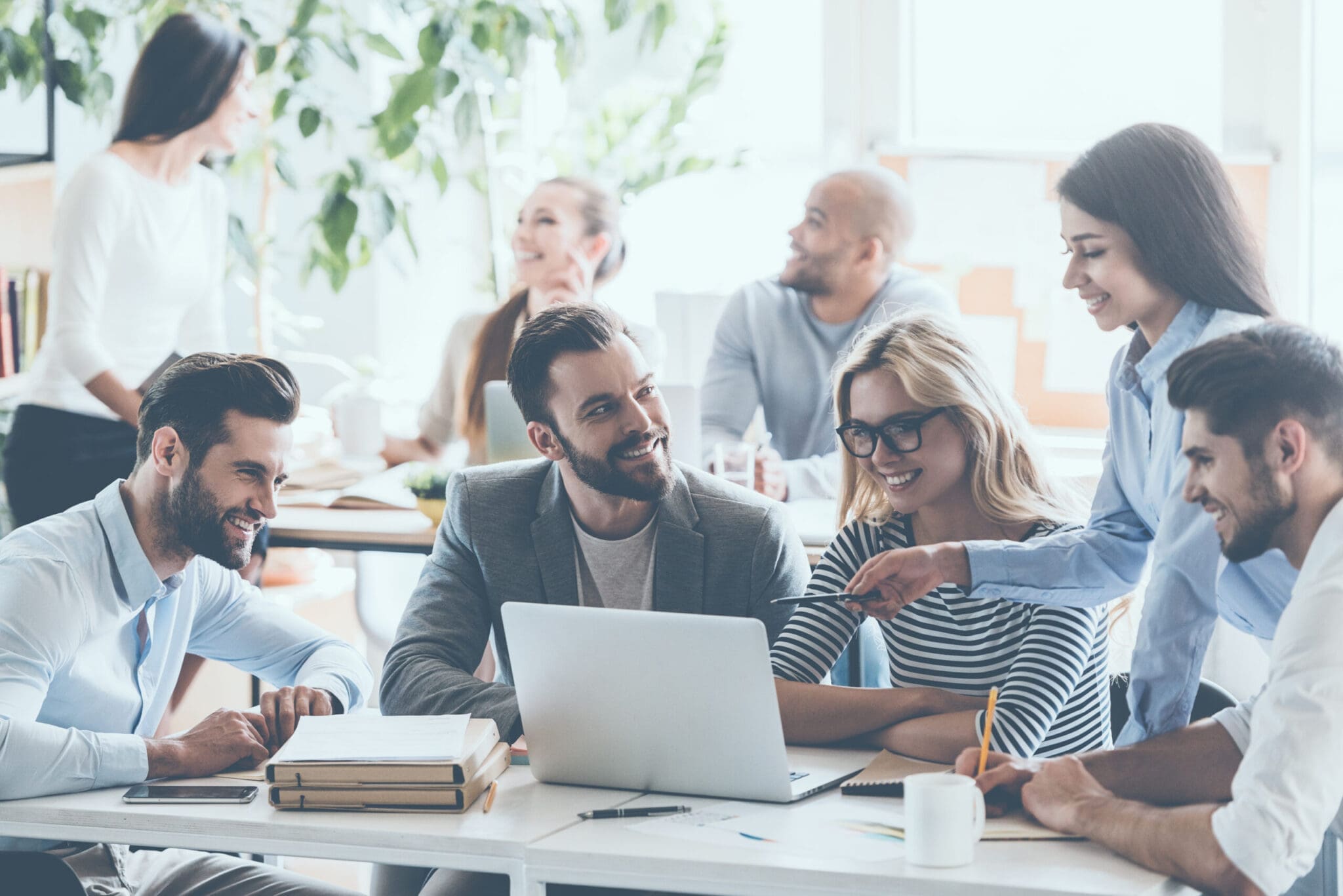 Discussing,Successful,Project.,Group,Of,Young,Cheerful,Business,People,Working