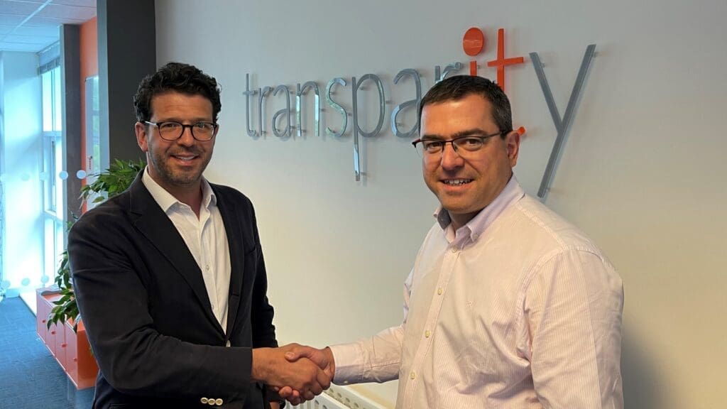 Paul Bolt, MD at Transparity shakes hands with David Jobbins, CEO Transparity