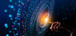 A conceptual image of a person’s finger touching a golden light in the centre of a vortex.